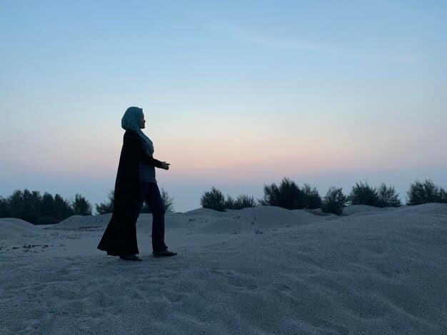 A dramatic shot of Ciri standing in the middle of the Korath desert, silhouetted against a fiery sunset. Her expression is determined, and she is clutching her sword tightly, ready to face whatever challenges lie ahead.