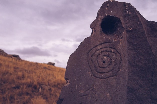 A close-up view of a monolith's surface, showing intricate carvings and glyphs. The symbols seem to glow faintly, suggesting a connection to an unseen energy source. The texture of the monolith is weathered and ancient, indicating its age.