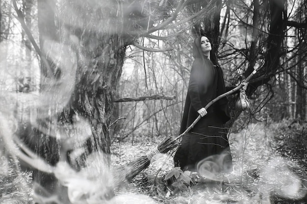 A dramatic scene of a witch in ragged robes casting a curse in a graveyard during a lightning storm. The witch is holding a gnarled staff and chanting, and the lightning illuminates a zombie figure rising from a grave in the background.
