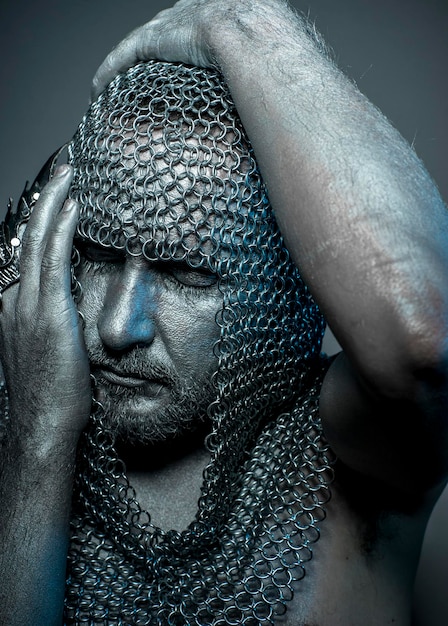 A close-up shot of the new Geralt figure, highlighting the intricate details of his armor, swords, and facial features. The background is blurred to emphasize the figure's craftsmanship.