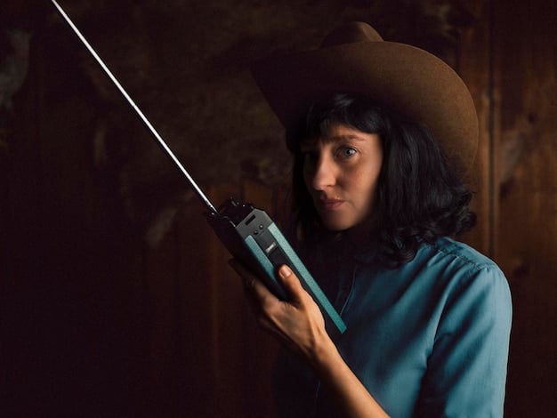 A modern-day paranormal investigator using electronic equipment, like an EMF meter and audio recorder, in a dark, abandoned building.