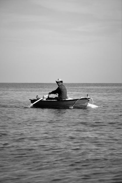 A black and white photo of the USS Eldridge, a U.S. Navy destroyer escort, sailing on the open ocean, with a sense of historical authenticity.