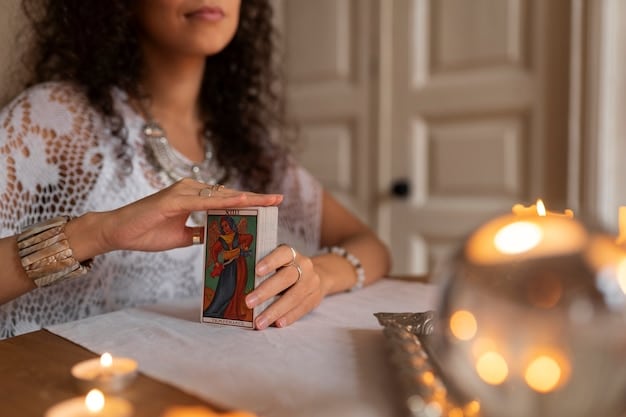 Close-up of a hand selecting a tarot card from a beautifully illustrated deck on a wooden table, with soft, natural light enhancing the mystical ambiance.