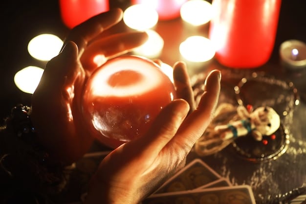 A close-up of a hand holding a crystal over a tarot card spread, illuminated by candlelight, representing divination practices in witchcraft traditions.