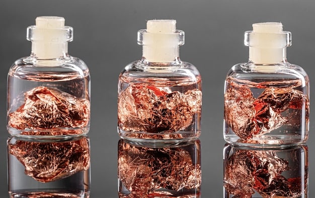 An overhead shot showcasing three crystal elixirs in clear glass bottles. Each bottle is surrounded by its corresponding crystal: amethyst, rose quartz, and clear quartz. The setting includes soft lighting, natural elements like flower petals, and small labels indicating the elixir names.
