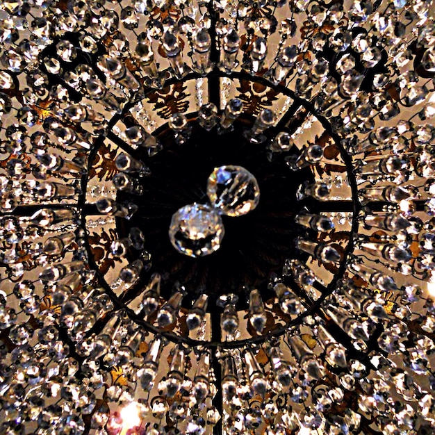 A close-up of a central crystal in a grid, surrounded by smaller amplifying crystals. The image highlights the geometric pattern and the intricate placement of each crystal.