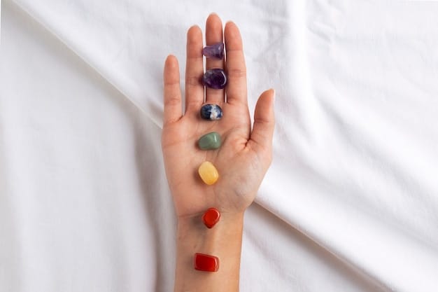 A close-up image of a person's hands holding a selection of chakra stones, each a different color and type of crystal. The background is softly blurred, highlighting the smooth textures and vibrant colors of the stones, conveying a sense of peace and healing.