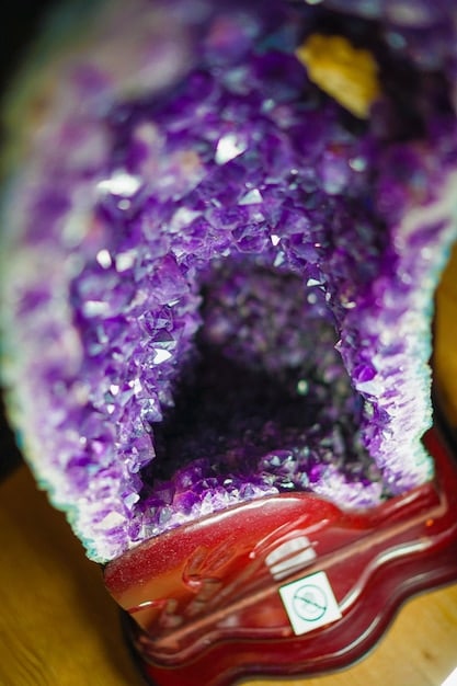 A close-up shot of a cluster of amethyst crystals, highlighting their deep purple color and intricate crystalline structure, symbolizing their calming and spiritual properties.