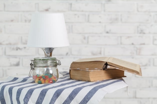 A bedside table with a lamp, a book, and a few pieces of crystal jewelry, including a moonstone pendant and a rose quartz bracelet, set in a softly lit bedroom. The scene suggests relaxation and preparation for sleep.