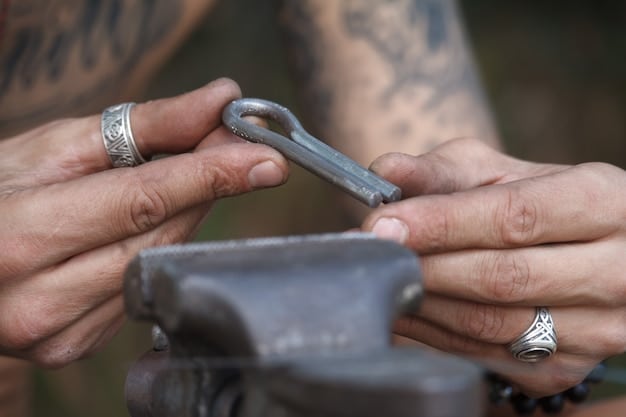 A close-up of a craftsman meticulously carving protective symbols onto a small amulet made of wood. The scene is set in a dimly lit workshop, with various tools and half-finished amulets scattered around. The lighting is focused on the craftsman's hands and the intricate details of the carving, highlighting The Power of Amulets: Which Protection Charms Are Most Effective? A Comprehensive Guide to crafting meaningful protective symbols.