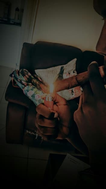 A close-up of a hand drawing a Tarot card from a deck. The card is The Fool, and the background is blurred, creating focus on the card and the act of drawing.