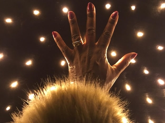 A close-up shot of a witch's hands drawing a sigil in the air with glowing light. The sigil is complex and intricate, representing a specific intention. The background is dark and mystical, emphasizing the power and focus of the visualization technique in spellcasting. The light reflects Advanced Spellcasting Techniques concepts as its foundation.