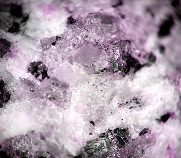 A detailed shot of a lepidolite crystal, showing its distinctive layers and shimmering lilac hue. The crystal is placed on a soft, neutral-colored cloth to emphasize its texture. The lighting is focused to highlight the crystal's natural shimmer and mineral composition. It represents the anxiety relief that can be achieved with lepidolite, one of The Top 5 Crystals for Reducing Stress and Anxiety in 2025 (and How to Use Them).
